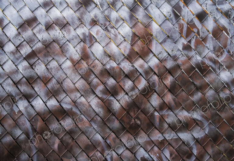 Detail of graffiti paint covering chain-link fence