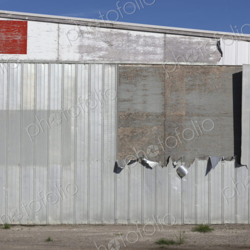Detail of old warehouse, peeling metal on siding, Detail of old warehouse, peeling metal on siding,