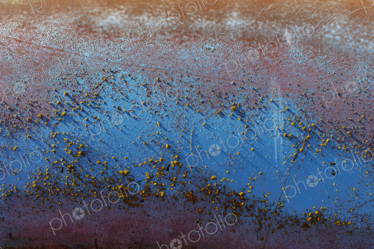 Detail of peeling blue paint and rust