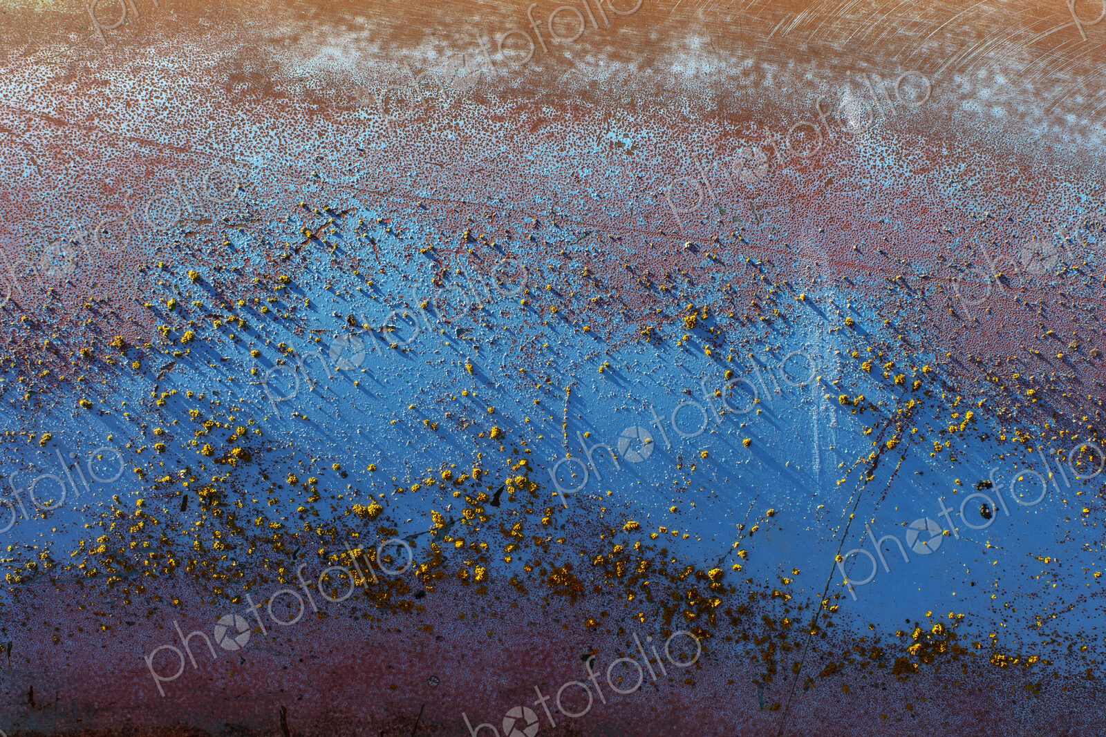 Detail of peeling blue paint and rust