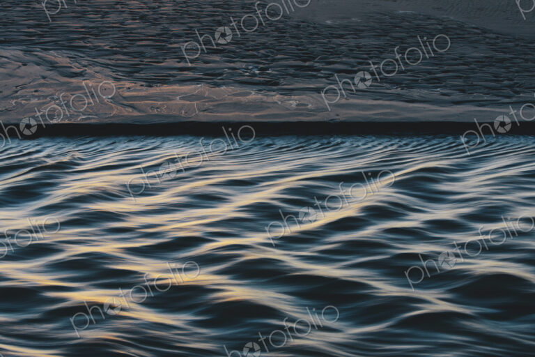 Detail of sunlight reflecting on small waves from flowing stream, Arcadia Beach State Park