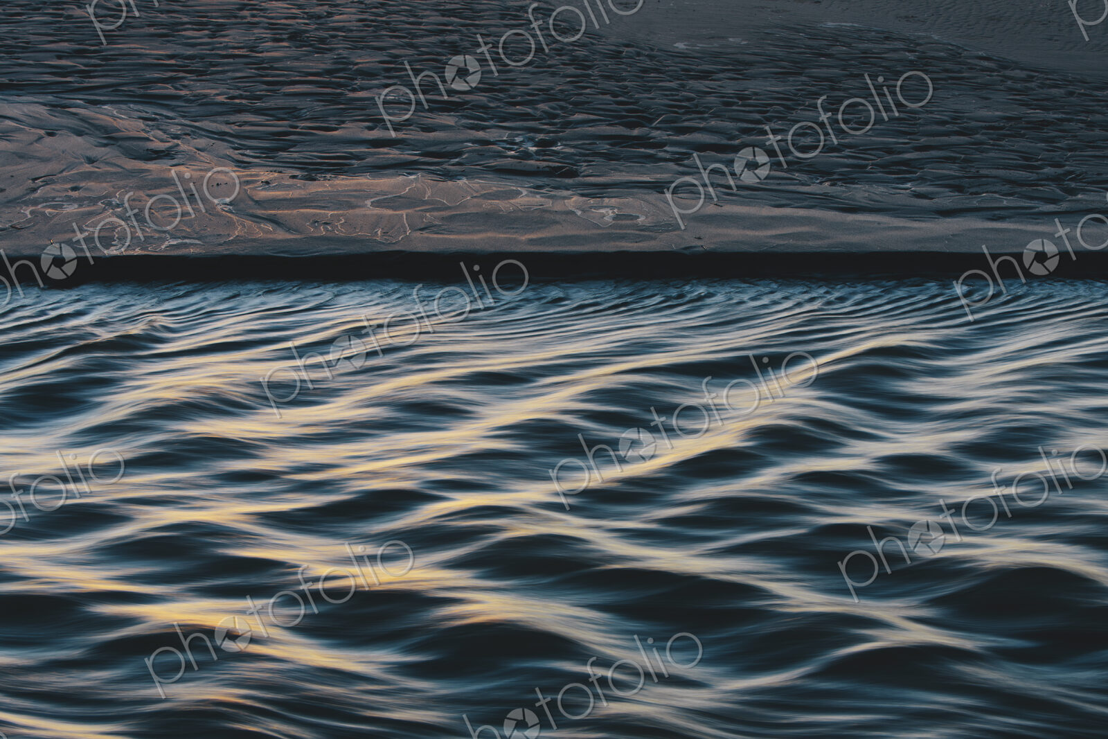 Detail of sunlight reflecting on small waves from flowing stream, Arcadia Beach State Park