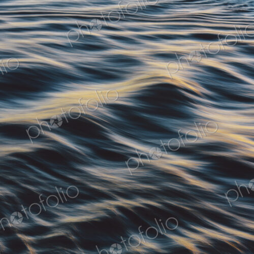 Detail of sunlight reflecting on small waves on the water surface offshore. Detail of sunlight reflecting on small waves on the water surface offshore.