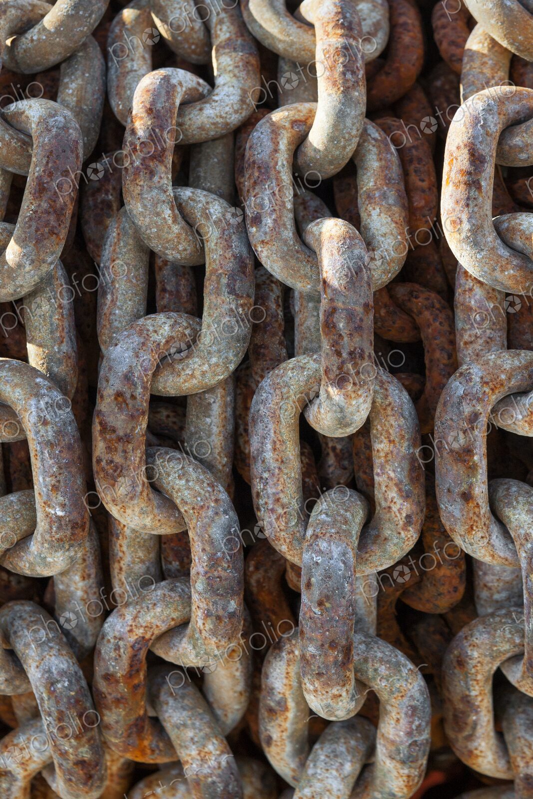 Detailed view of an old, rusted chain at Charleston Marina, Oregon, highlighting…