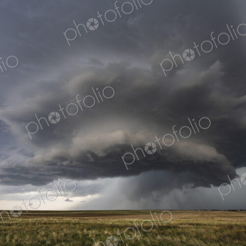 Developing Mesocyclone, a towering two layer shape above the horizon, storm clouds… Developing Mesocyclone, a towering two layer shape above the horizon, storm clouds…
