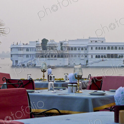 Dining Tables with Lake Palace in Background Dining Tables with Lake Palace in Background