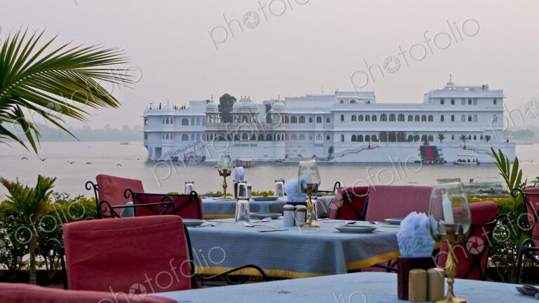 Dining Tables with Lake Palace in Background