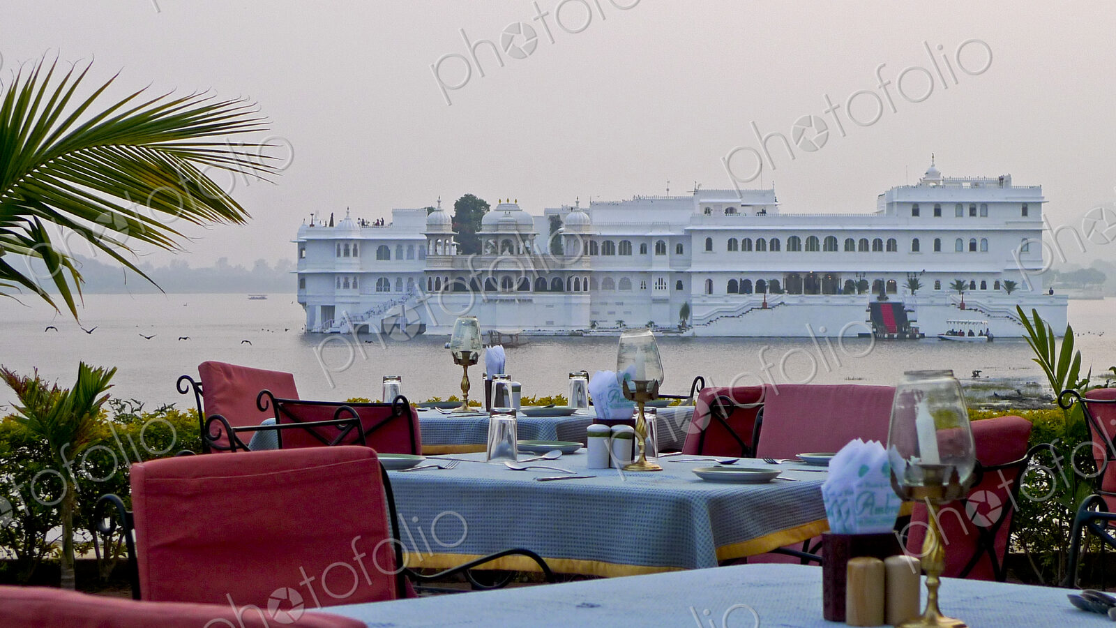 Dining Tables with Lake Palace in Background