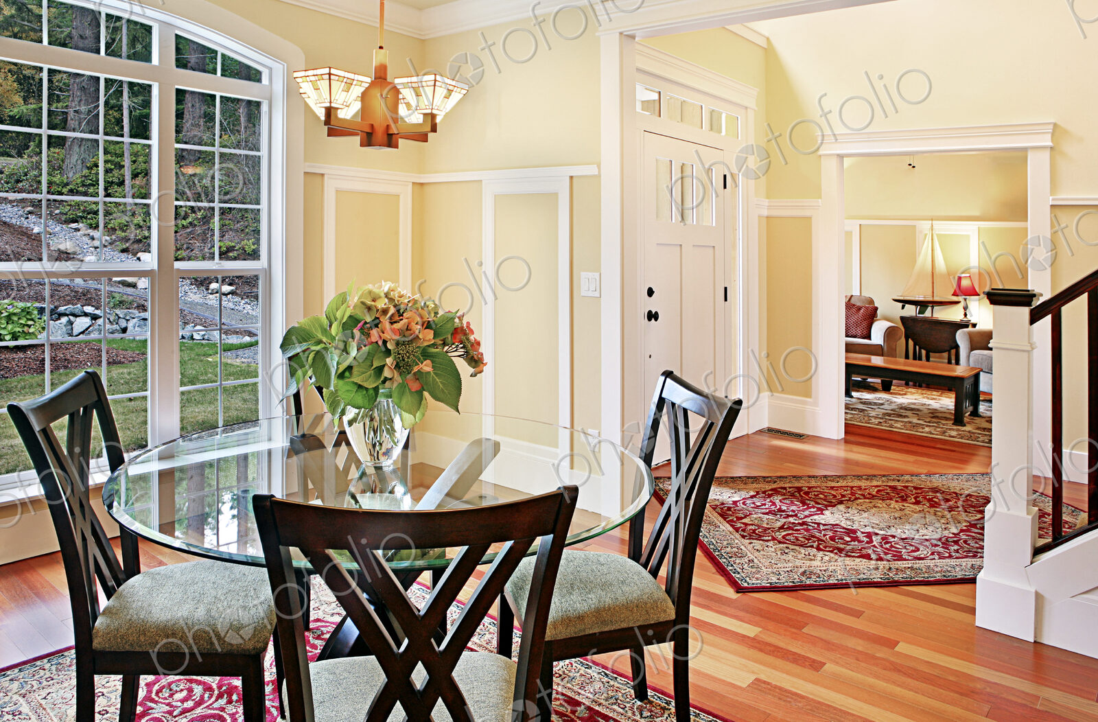 Dining table and chairs near staircase