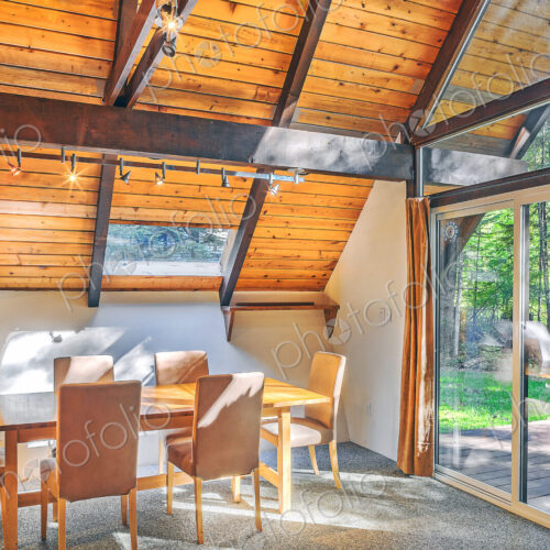 Dining table and windows in rustic dining room