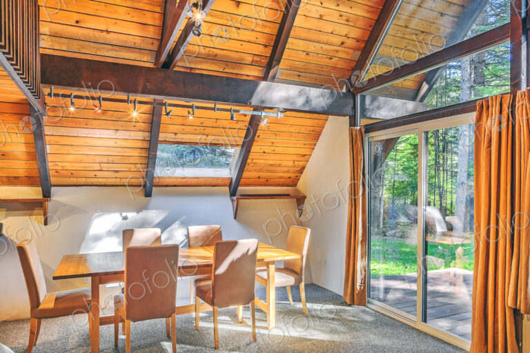 Dining table and windows in rustic dining room