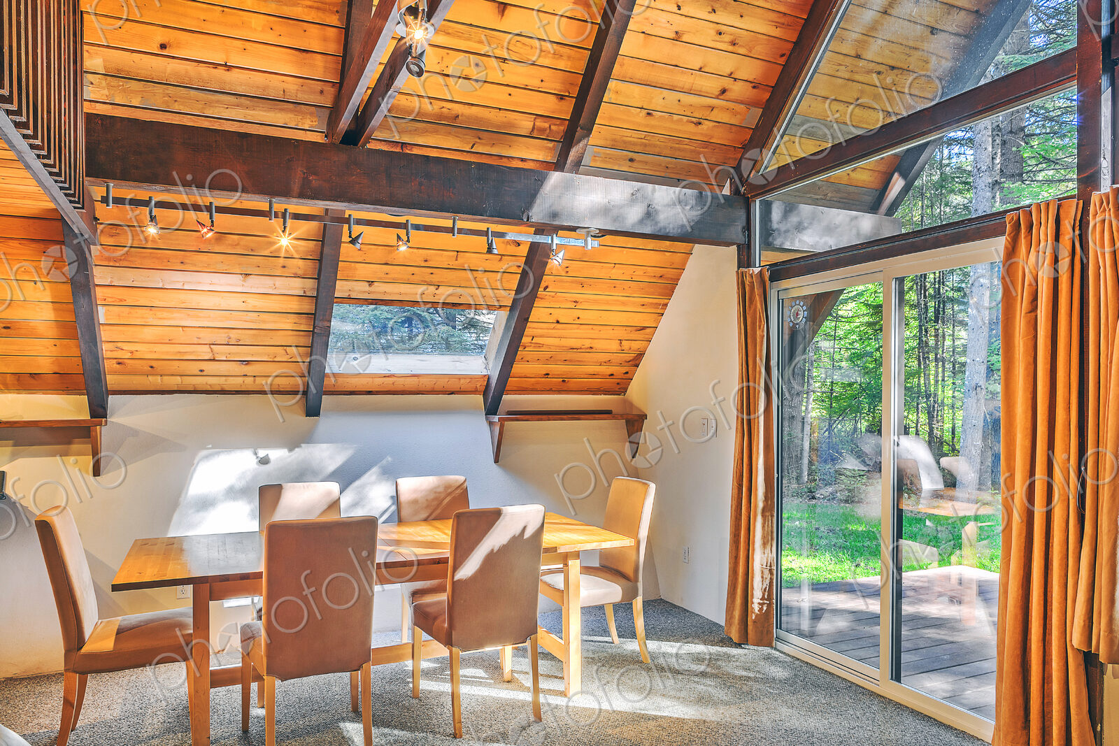 Dining table and windows in rustic dining room