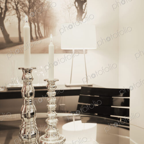 Dining table with candles in dining room.