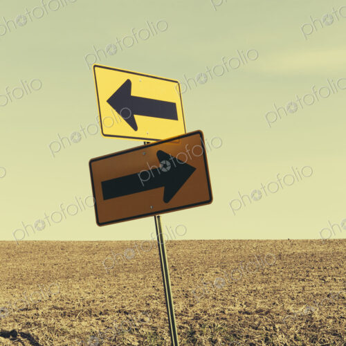 Directional arrow sign, farmland in background, near Pullman