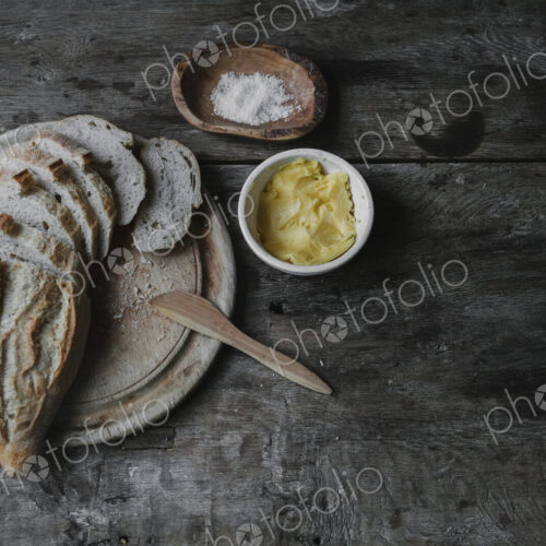 Dishes and bread laid out on a table. Dishes and bread laid out on a table.