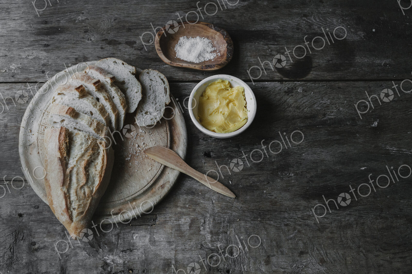 Dishes and bread laid out on a table.
