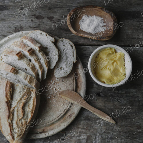 Dishes and bread laid out on a table. Dishes and bread laid out on a table.