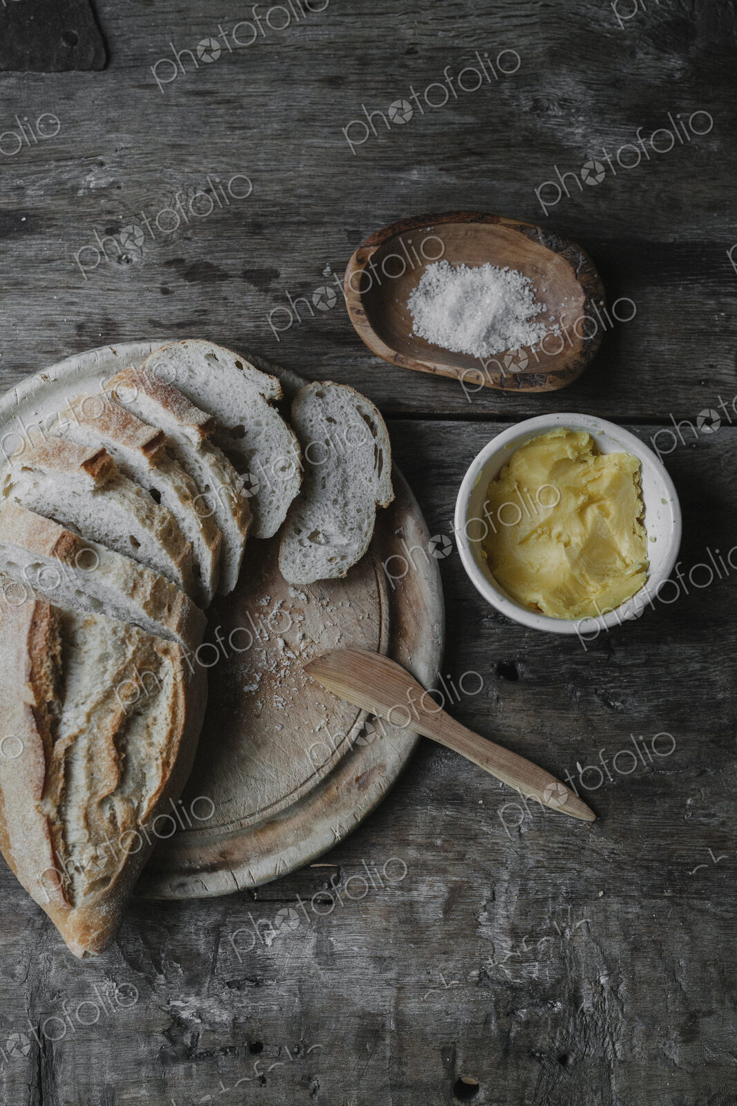 Dishes and bread laid out on a table.