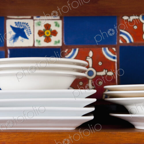 Dishes in Front of Colorful Tile Dishes in Front of Colorful Tile