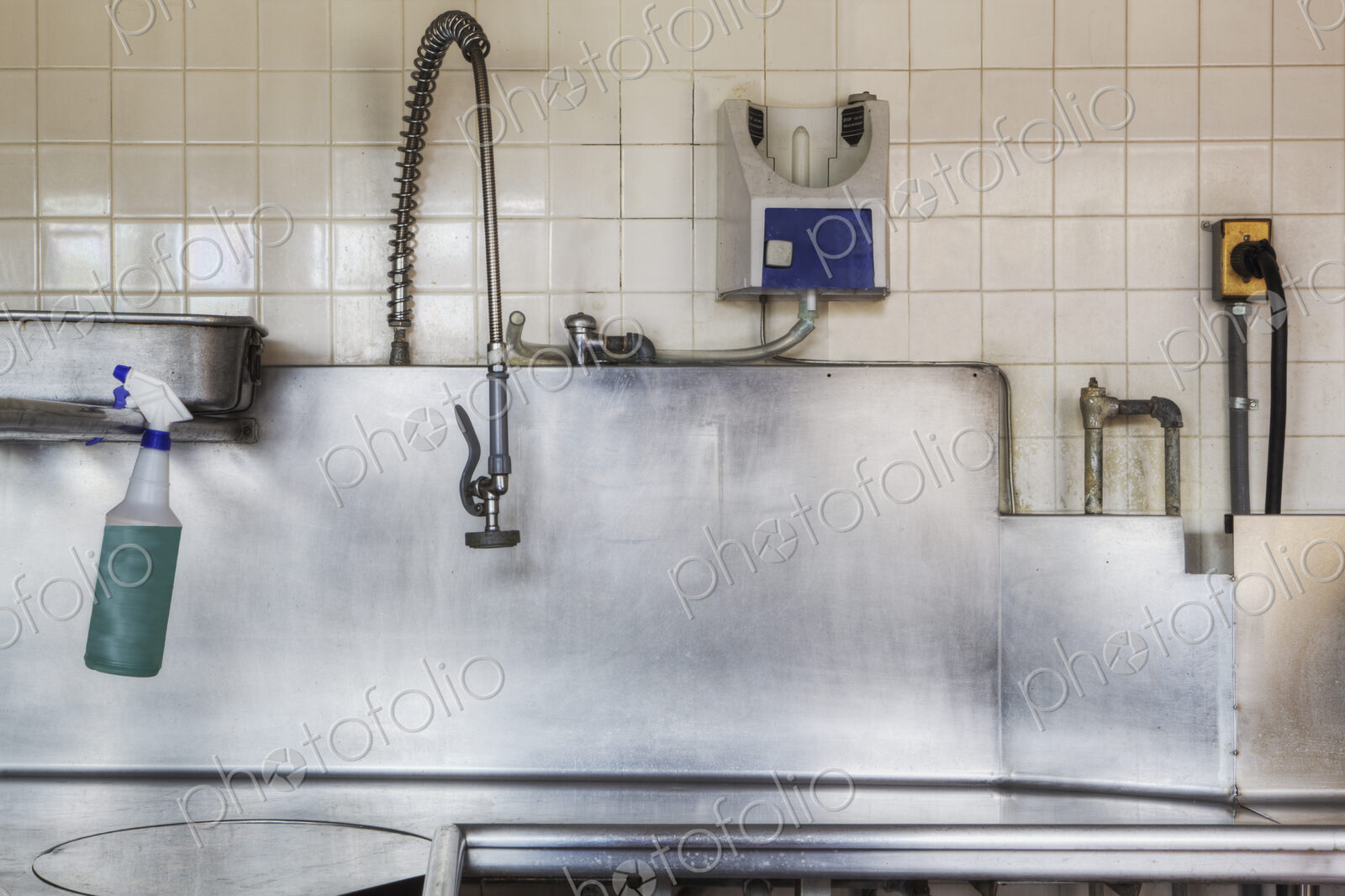 Dishwashing Station with stainless steel surfaces in large catering kitchen