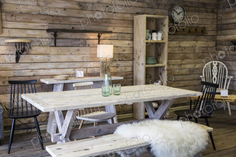 Display of furniture made from recycled wood, including dining table and bench,…