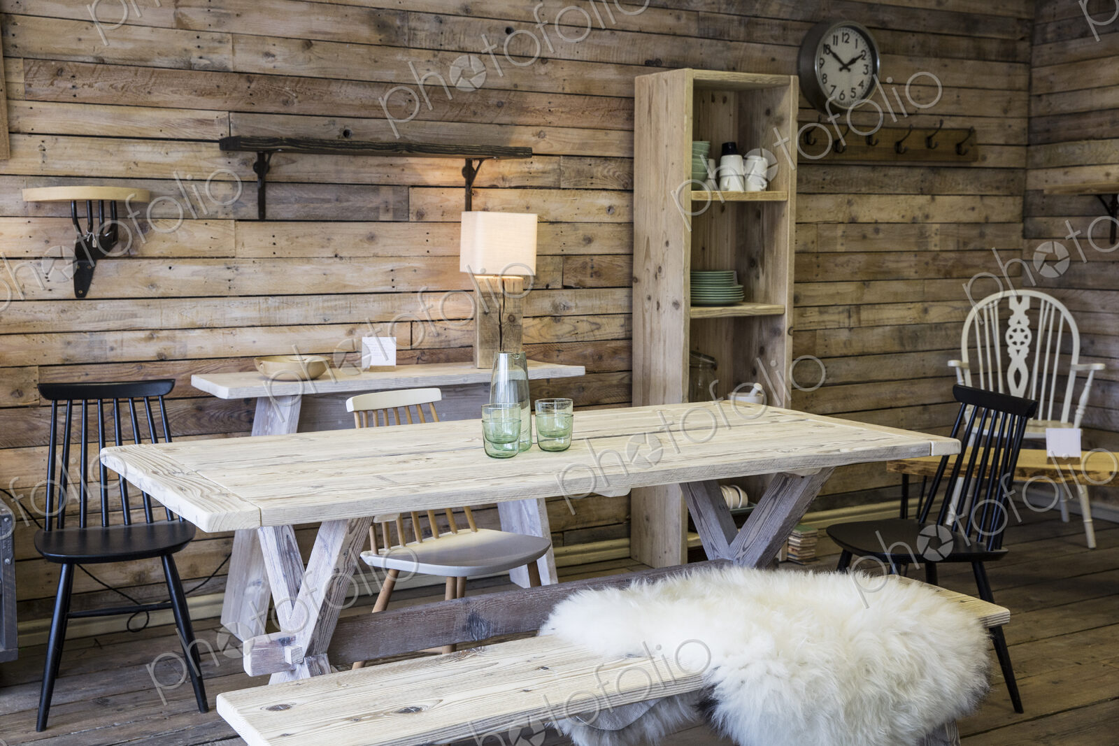 Display of furniture made from recycled wood, including dining table and bench,…