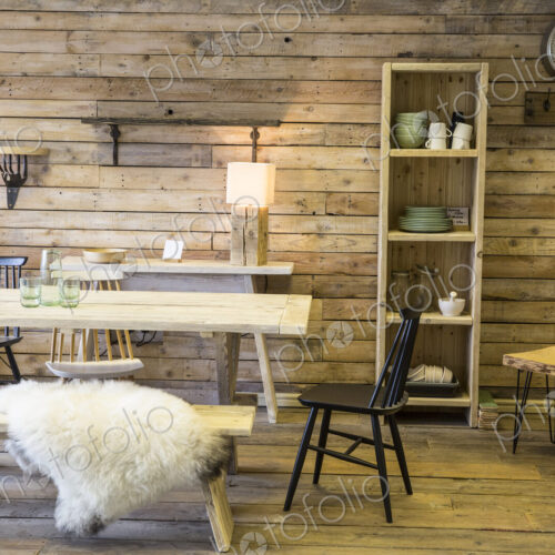 Display of furniture made from recycled wood, including dining table and bench,… Display of furniture made from recycled wood, including dining table and bench,…