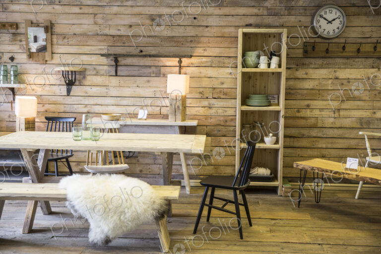 Display of furniture made from recycled wood, including dining table and bench,…