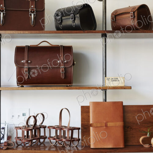Display of leather goods on shelves. Briefcases and bags.