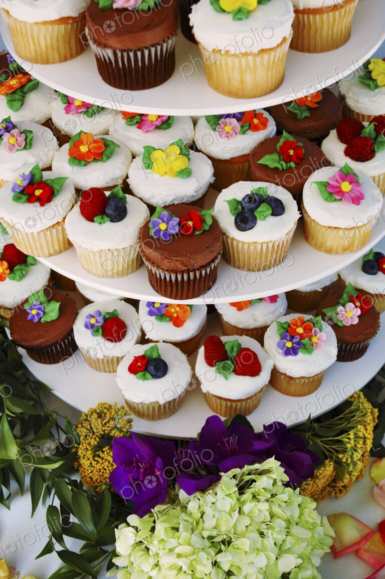 Display stand with decorated floral cupcakes