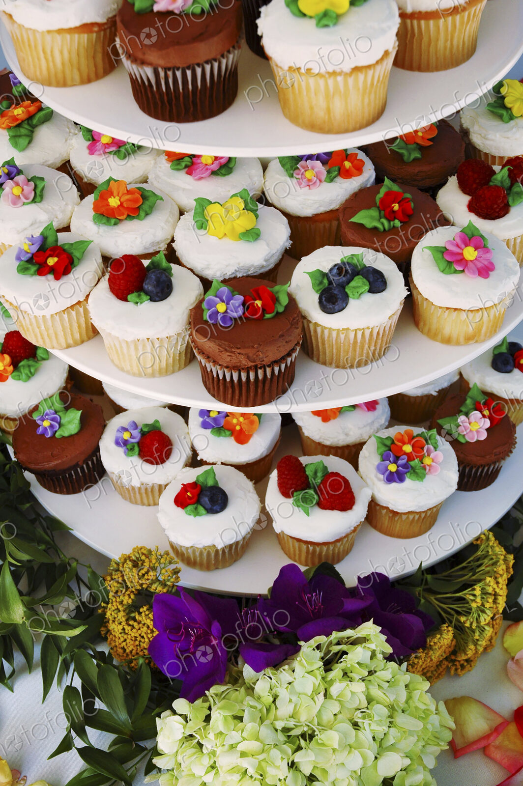 Display stand with decorated floral cupcakes