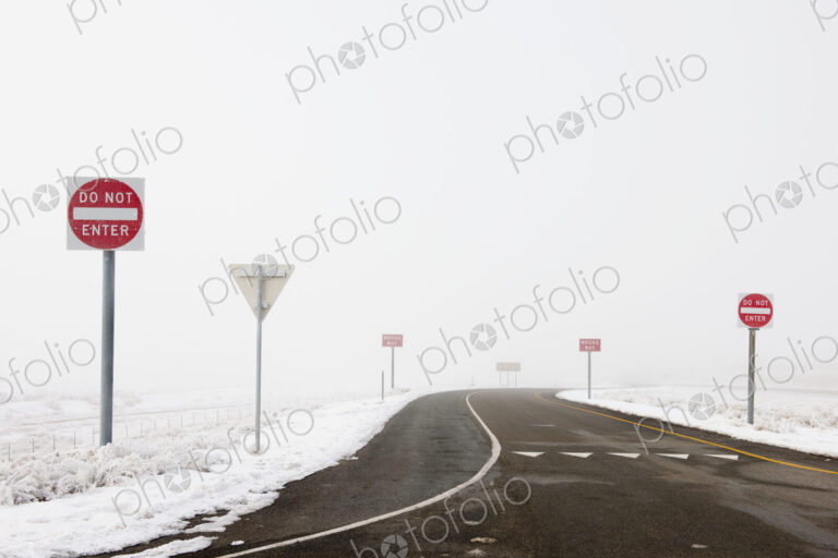 'Do Not Enter' Signs by Snowy Road