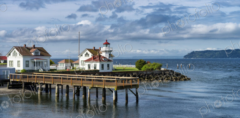 Dock and buildings on scenic coastline