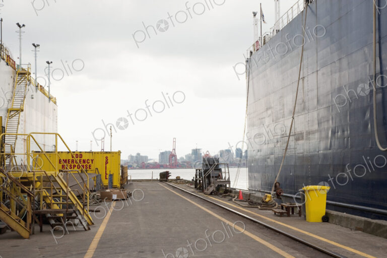 Dockside with large ship moored