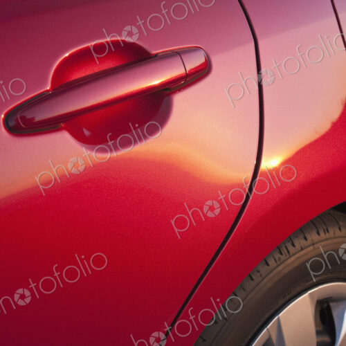 Door Handle of a Red Car