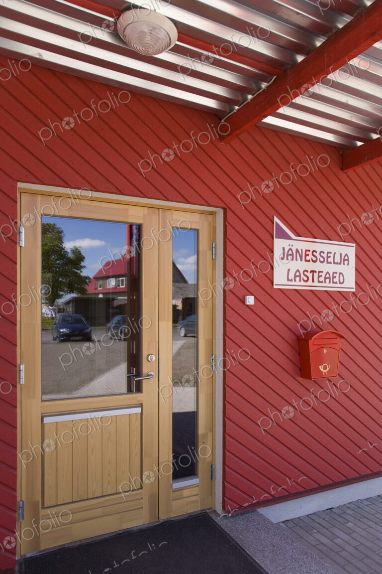 Door In Red Building And Reflection