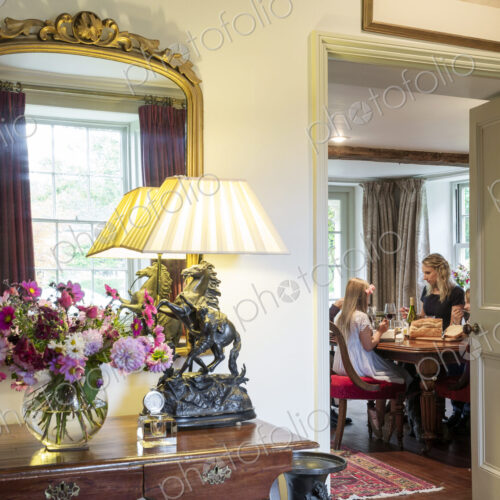Doorway to Caucasian mother and daughter eating in dining room Doorway to Caucasian mother and daughter eating in dining room
