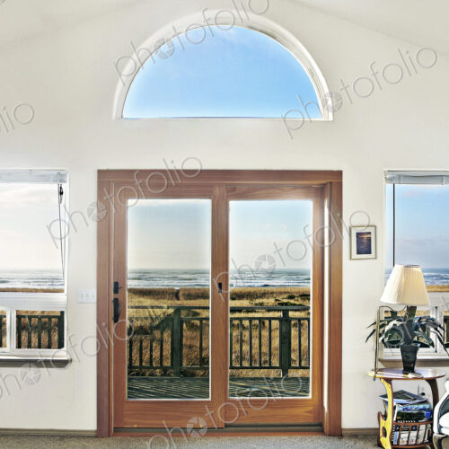 Double doors of modern house on beach Double doors of modern house on beach