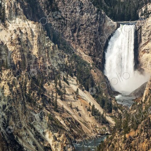 Dramatic view of Lower Falls in Yellowstone National Park, Wyoming, with rugged canyon… Dramatic view of Lower Falls in Yellowstone National Park, Wyoming, with rugged canyon…