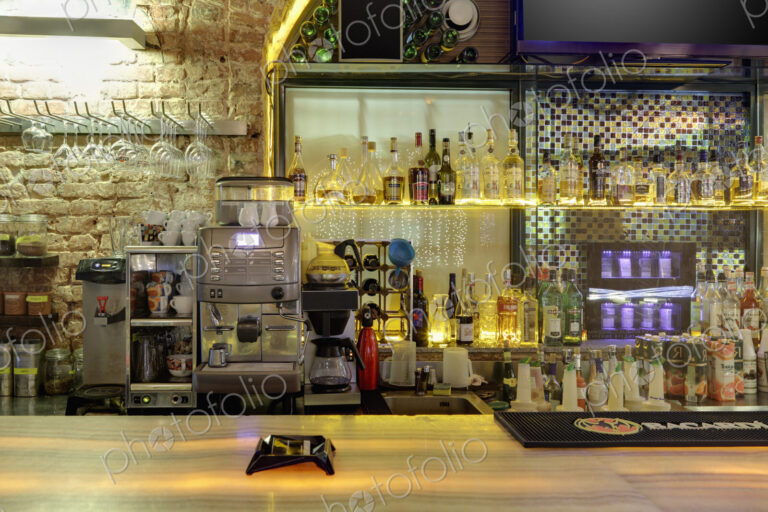 Drinks,coffee machine and cigarettes in bar.