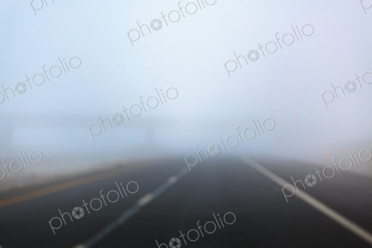 Driver’s perspective in fog on Interstate 90 in a rural area.