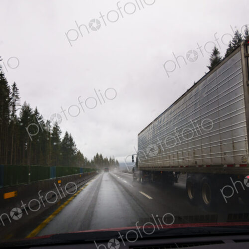 Driver's perspective through windshield of winter highway with semi-truck. Driver's perspective through windshield of winter highway with semi-truck.