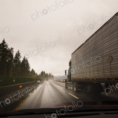 Driver's perspective through windshield of winter highway with semi-truck. Driver's perspective through windshield of winter highway with semi-truck.