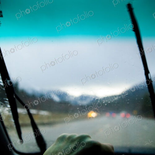 Driver's view through a car windshield on Interstate 90 during heavy rain. Driver's view through a car windshield on Interstate 90 during heavy rain.