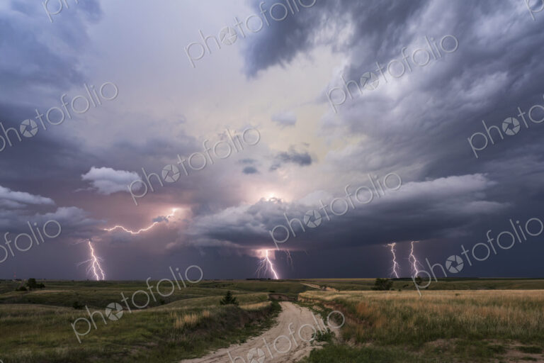 Dusk Lightning Show and Supercell storm clouds and activity in the sky.