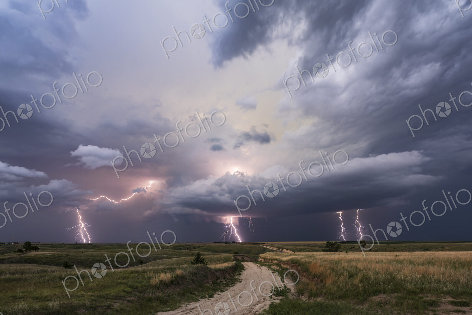 Dusk Lightning Show and Supercell storm clouds and activity in the sky.