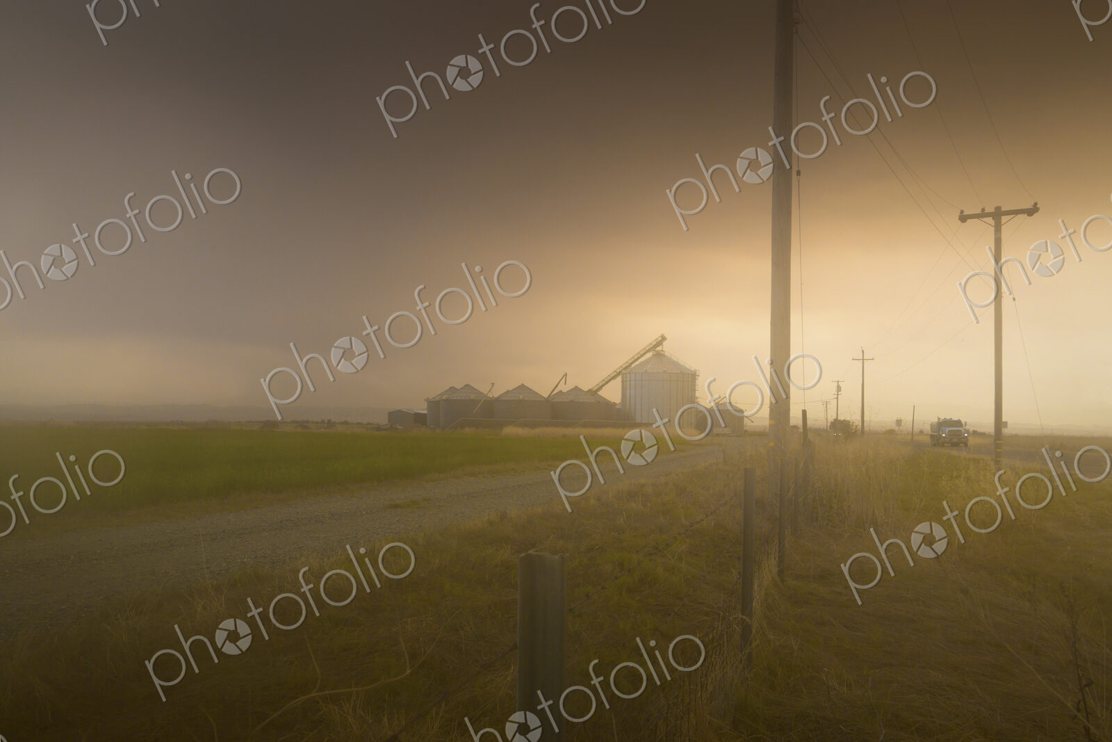 Dust storm over rural landscape