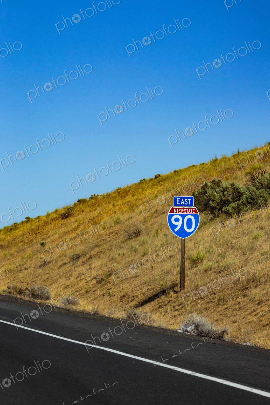 East I-90 Sign near Spague, a road sign on a road.