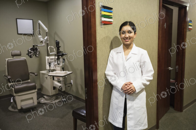 East Indian woman ophthalmologist in her office examination room.