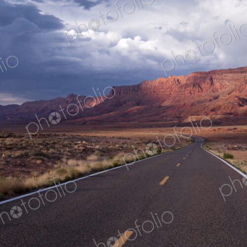 Echo Cliffs, a rock cliff formation of sandstone cliffs rising above a valley in…